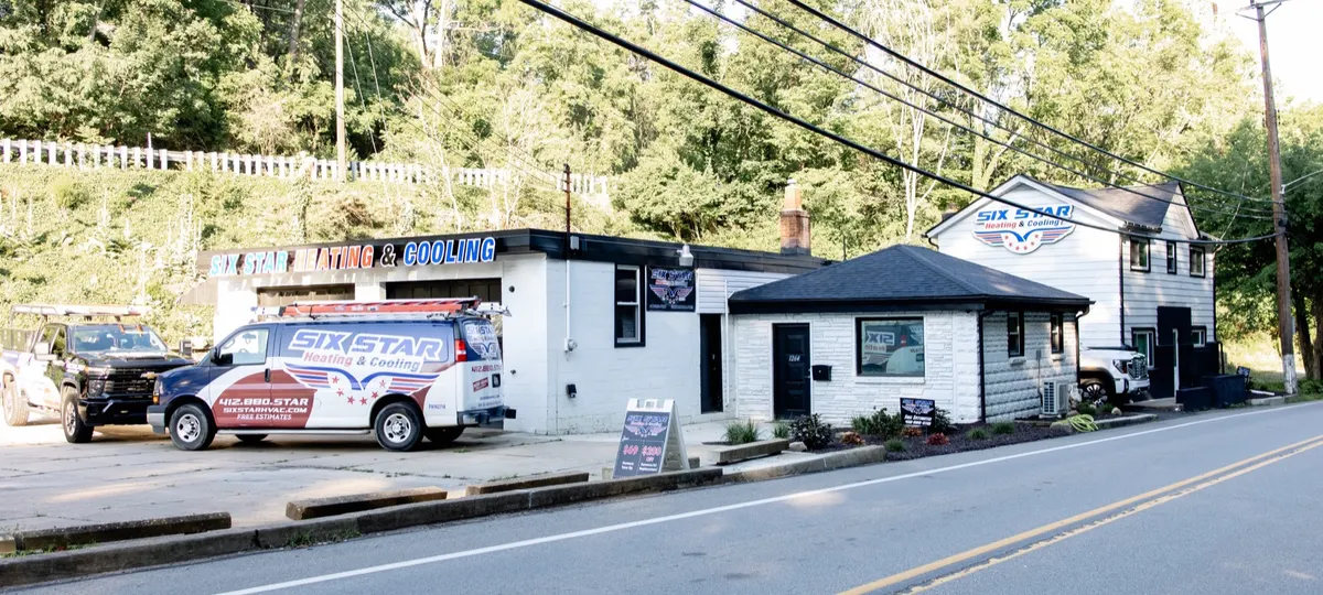The Six Star Heating & Cooling shop on Hope Hollow Road in Carnegie, PA, with a branded service van out front.